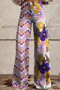 Pantalón retro floral Luna de Vega Madrid, diseño con estampados florales en tonos vibrantes y estilo vintage.