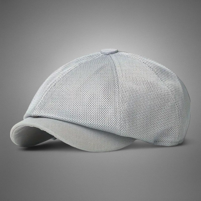 Gorra transpirable para hombre de Vega Madrid, diseño deportivo y cómodo, en color negro con detalles en gris.