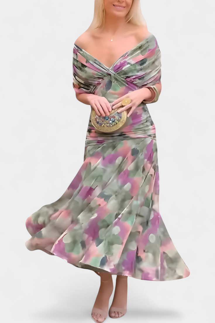 Vestido largo Celeste de Vega Madrid con escote cruzado y tejido fluido, muestra la prenda en un fondo neutro.
