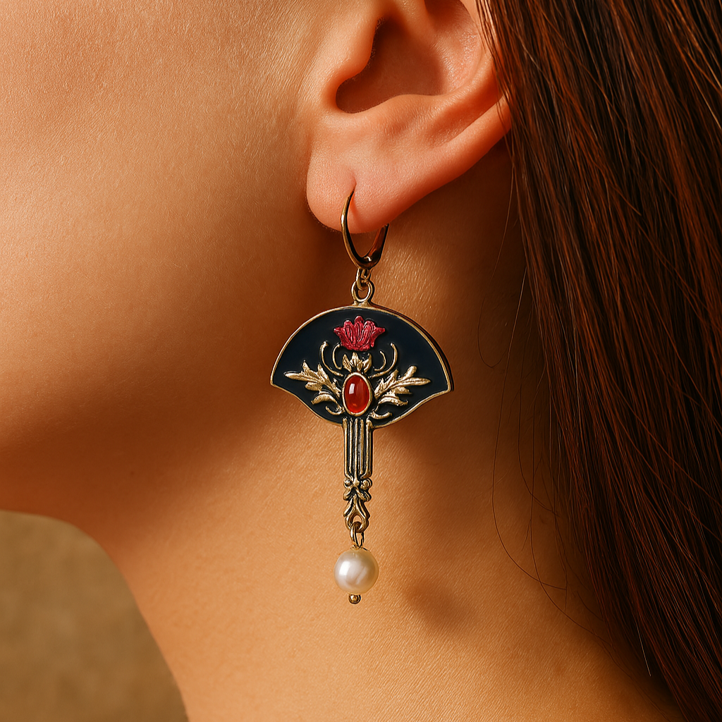 Pendientes boho de Vega Madrid con perlas blancas y cristales rojos, colgantes elegantes y estilo bohemio en diseño.