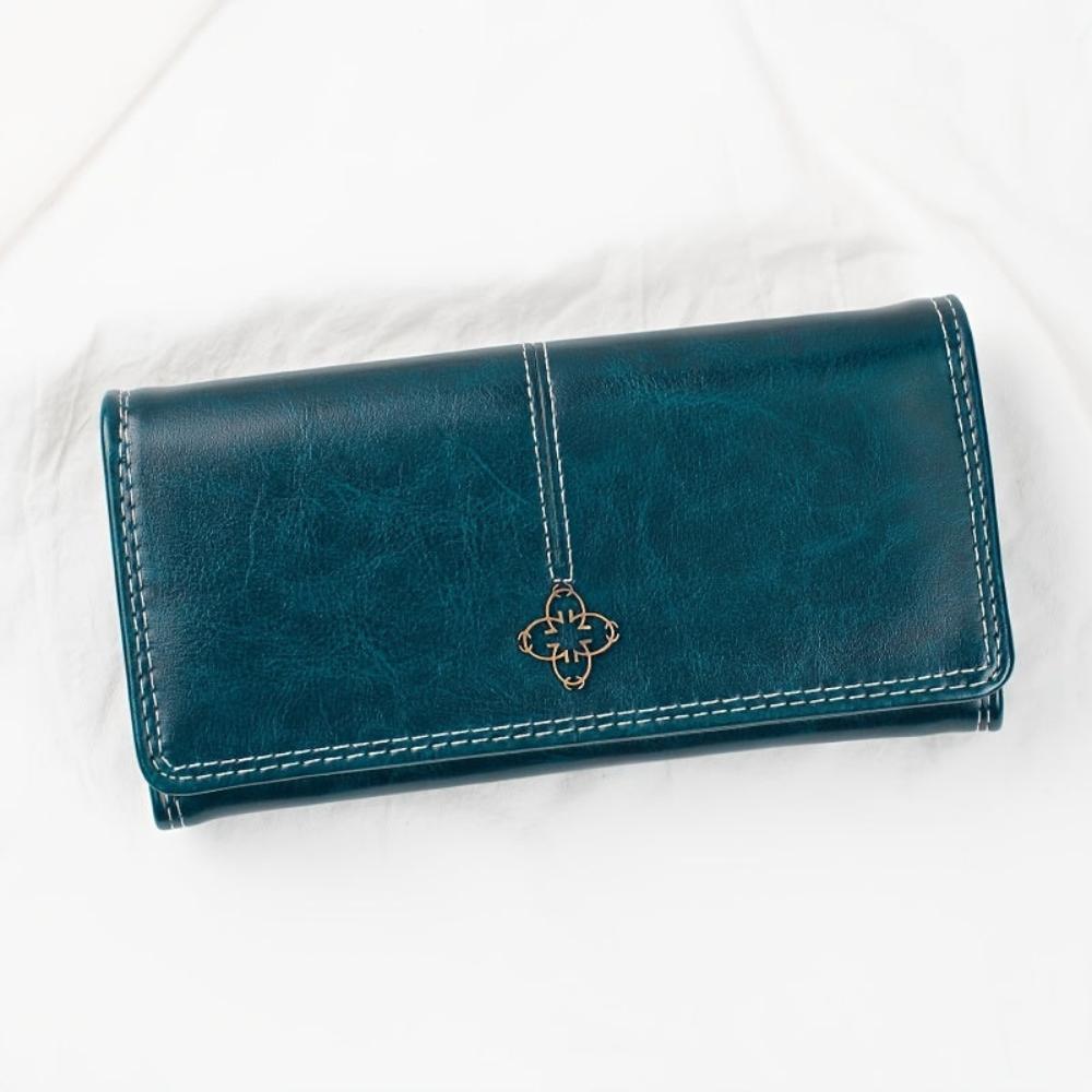 Cartera larga de piel Nicole de Vega Madrid, en color marrón, con múltiples compartimentos y diseño elegante.