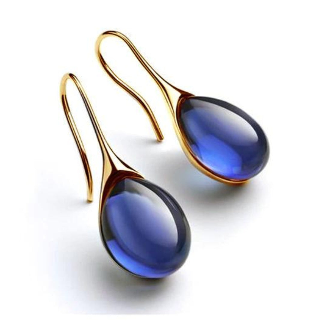 Pendientes colgantes dorados y plateados de Vega Madrid con diseño creativo y elegante, en acabado brillante y detallado.