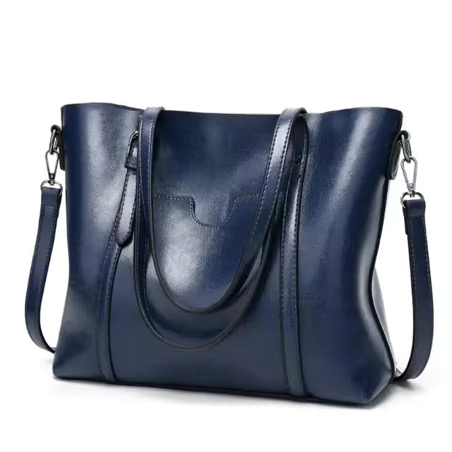 Bolso tote de piel Aubrey de Vega Madrid, bolso de cuero negro con detalles elegantes y asas resistentes.