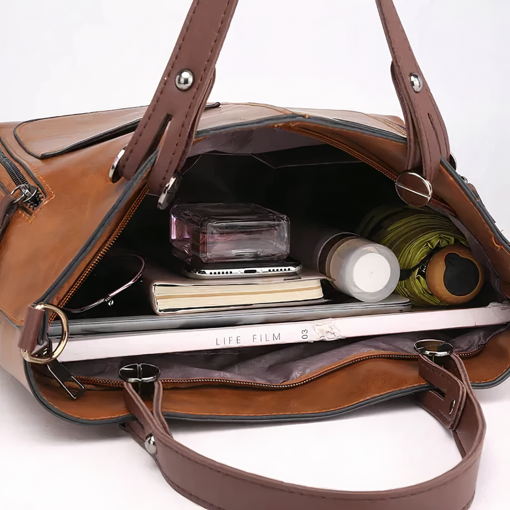 Bolso de piel Sydney de Vega Madrid, bolso versátil de diseño elegante con asas y cierre de lujo.