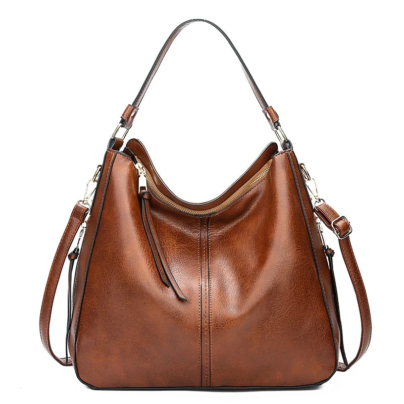 Bolso de hombro de piel Morgan de Vega Madrid, diseño elegante y clásico en color marrón con detalles en cuero.