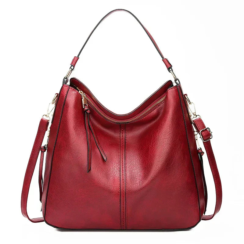 Bolso de hombro de piel Morgan de Vega Madrid, diseño clásico y elegante en color marrón con detalles de costura.