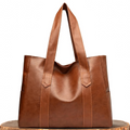 Bolso tote de piel Abigail de Vega Madrid, con diseño clásico y elegante, en color marrón y asa de mano resistente.