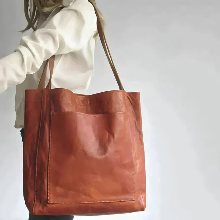 Bolso tote de piel Olivia de Vega Madrid, bolso de cuero clásico con asas y compartimentos espaciosos, diseño elegante y funcional.
