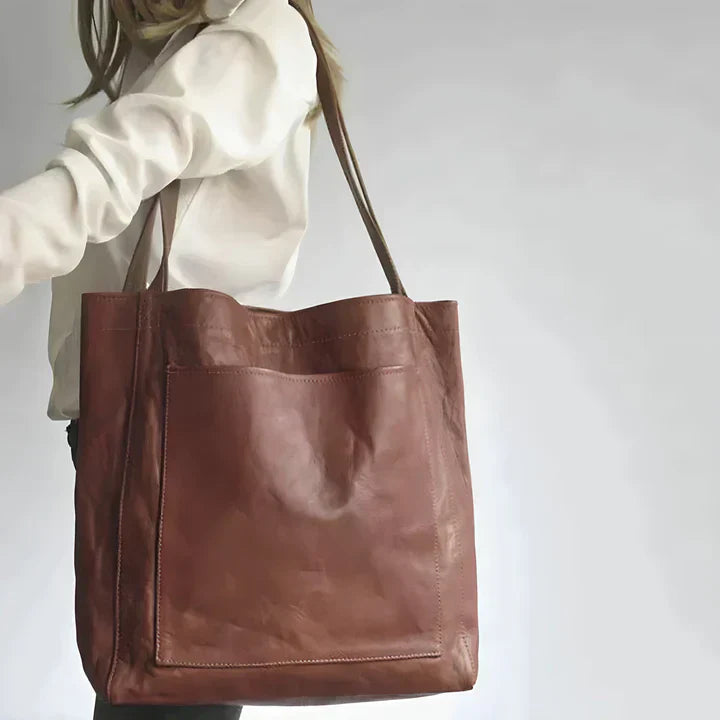 Bolso tote de piel Olivia de Vega Madrid, bolso clásico de cuero con asas robustas y acabado elegante, para uso diario.