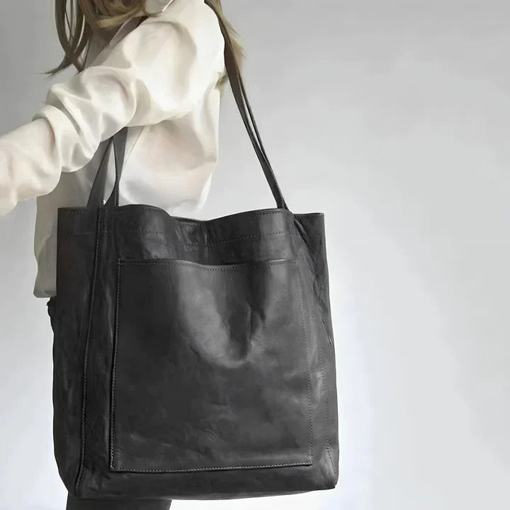 Bolso tote de piel Olivia de Vega Madrid, diseño clásico en color marrón con asas resistentes y detalles elegantes.
