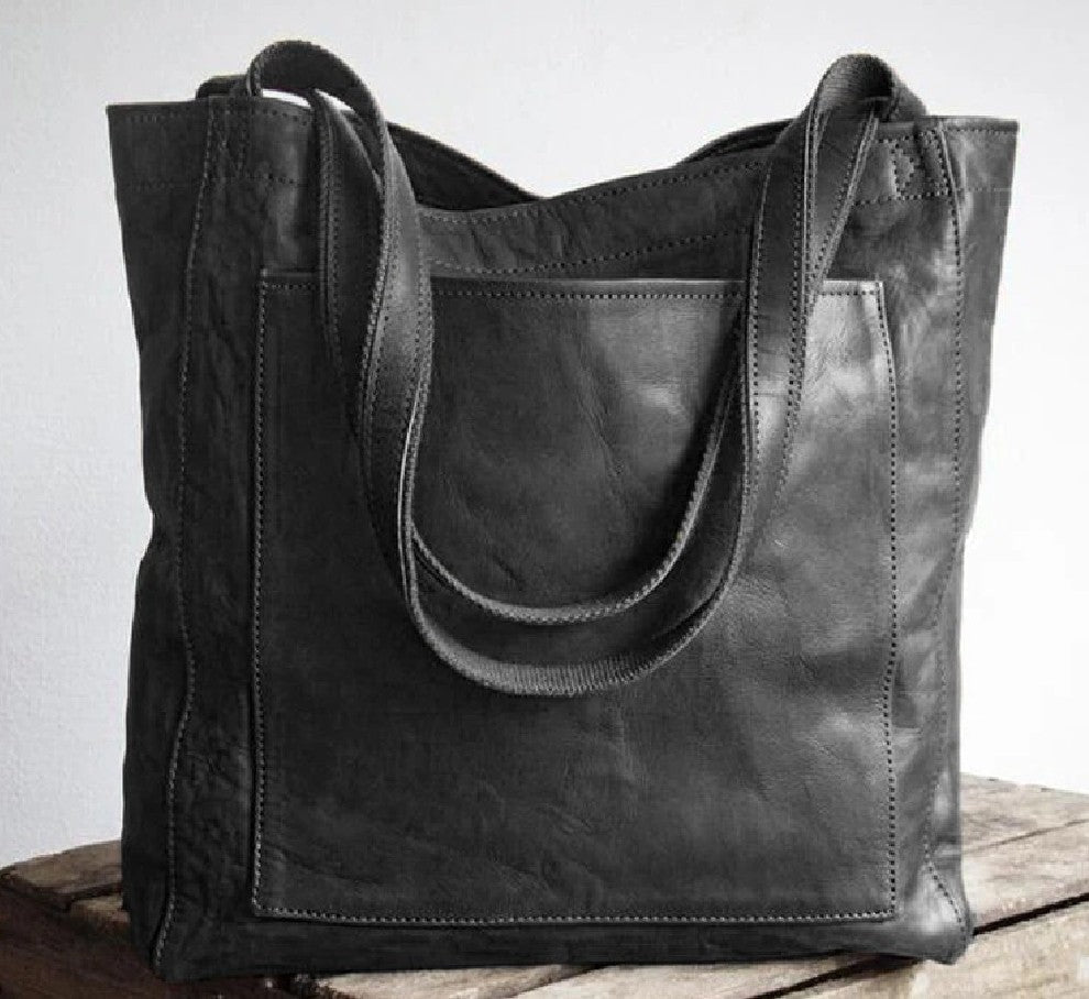 Bolso tote de piel Olivia de Vega Madrid, con diseño clásico, en color negro y asas robustas para uso diario.