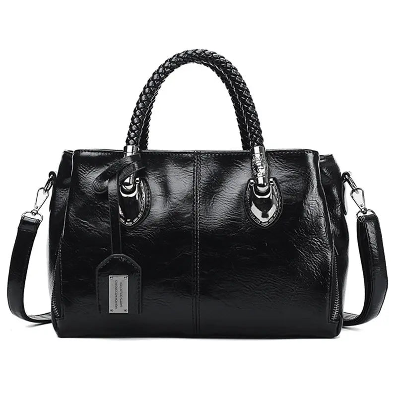 Bolso de piel Cassandra de Vega Madrid, bolso versátil con diseño elegante y detalles en cuero morado y negro.