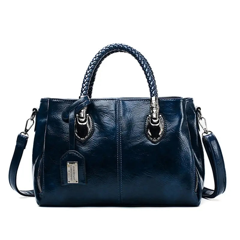 Bolso de piel Cassandra de Vega Madrid, bolso versátil con asa superior y detalles en cuero, en color negro.