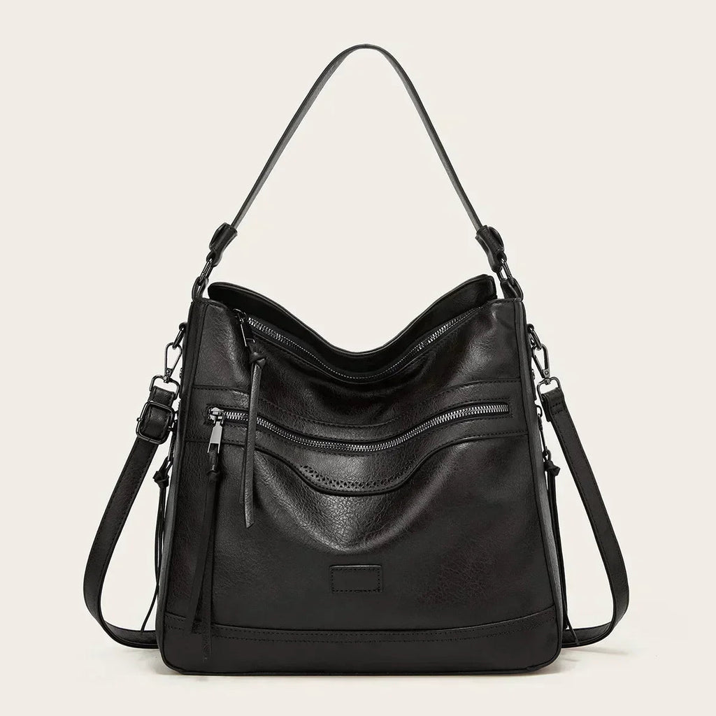 Bolso de hombro de piel Selena de Vega Madrid, diseño vintage en cuero con detalles elegantes y asas ajustables.