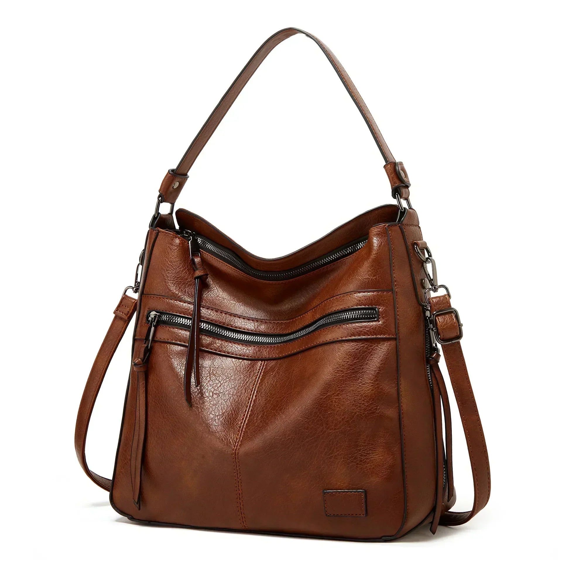 Bolso de hombro de piel Selena de Vega Madrid, vintage y elegante, con detalles en cuero en color marrón y asa ajustable.