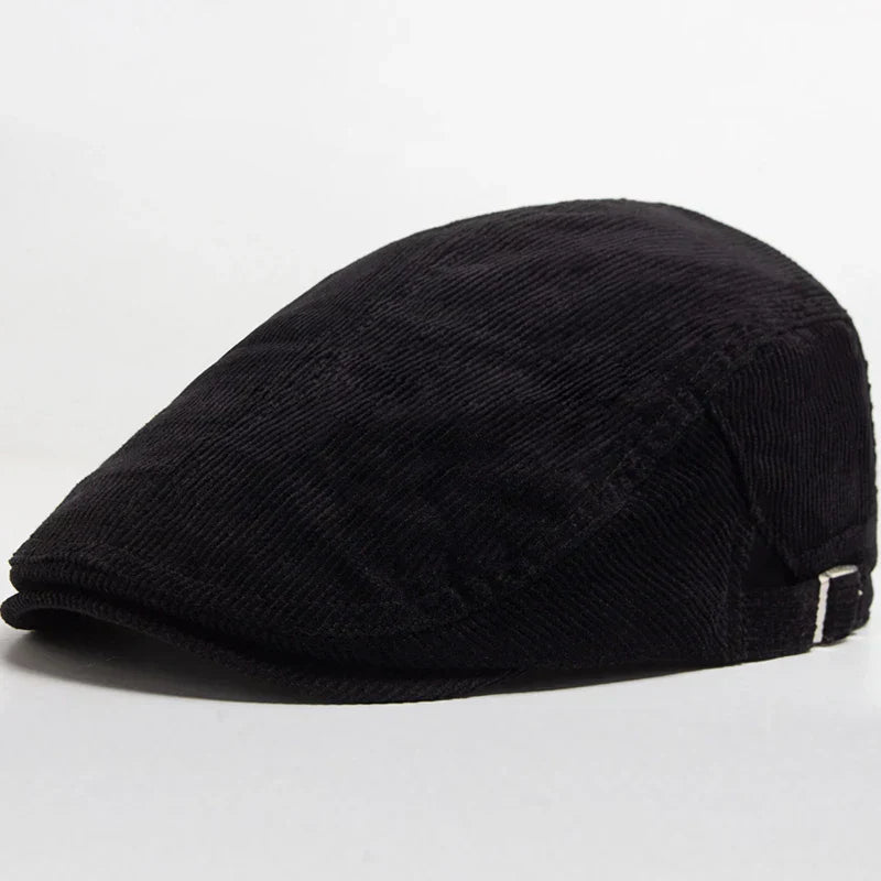 Gorra de pana para hombre Vega Madrid, estilo clásico, con visera curva y diseño en tonos neutros sobre fondo blanco.