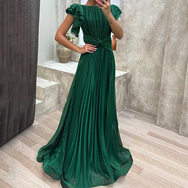 Vestido plisado elegante Valeria de Vega Madrid, diseñado para ocasiones formales y con detalles sofisticados.