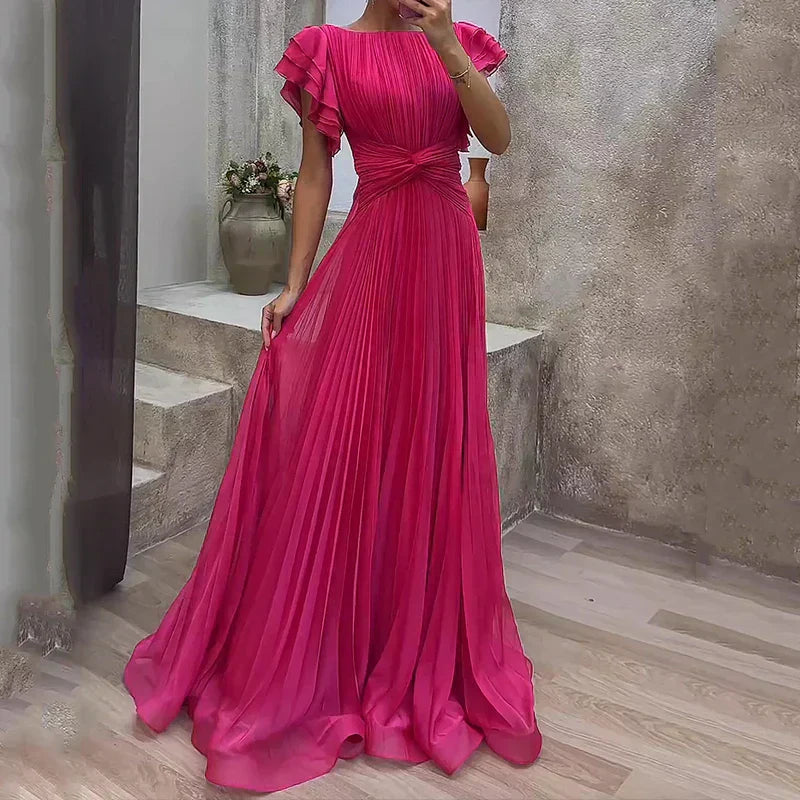 Vestido plisado elegante Valeria de Vega Madrid en color neutro, con diseño sofisticado y detalles delicados.