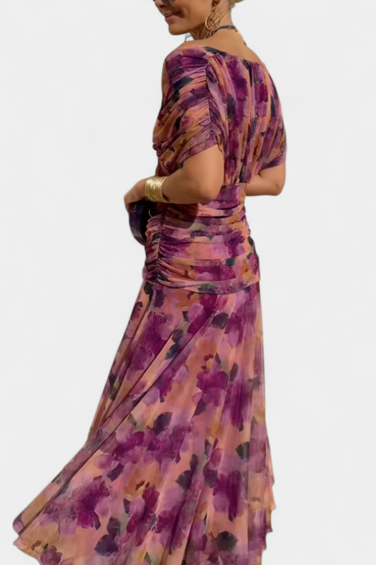 Vestido largo Celeste de Vega Madrid con escote cruzado y tejido fluido, mostrando su diseño elegante y cómodo.