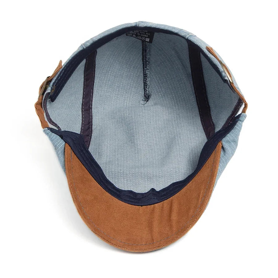Gorra plana vaquera Mateo de Vega Madrid, estilo clásico con acabado en denim y visera recta, vista frontal sobre fondo neutro.