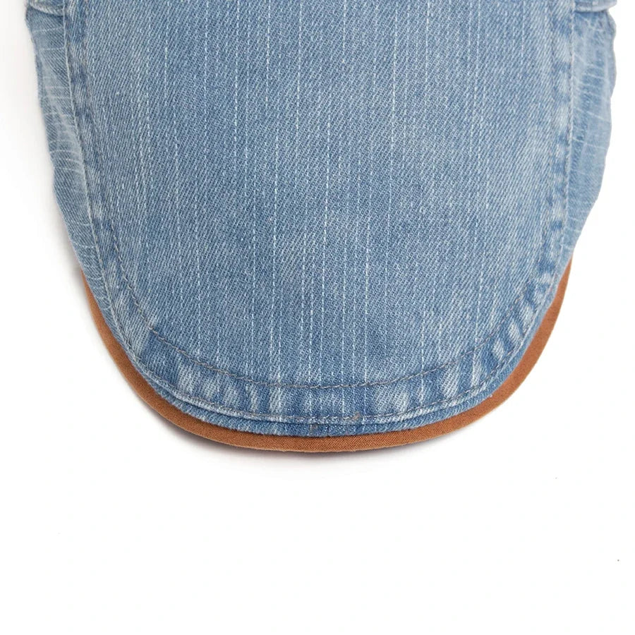Gorra plana vaquera Mateo de Vega Madrid, estilo clásico, con visera y acabado en tela de mezclilla azul.
