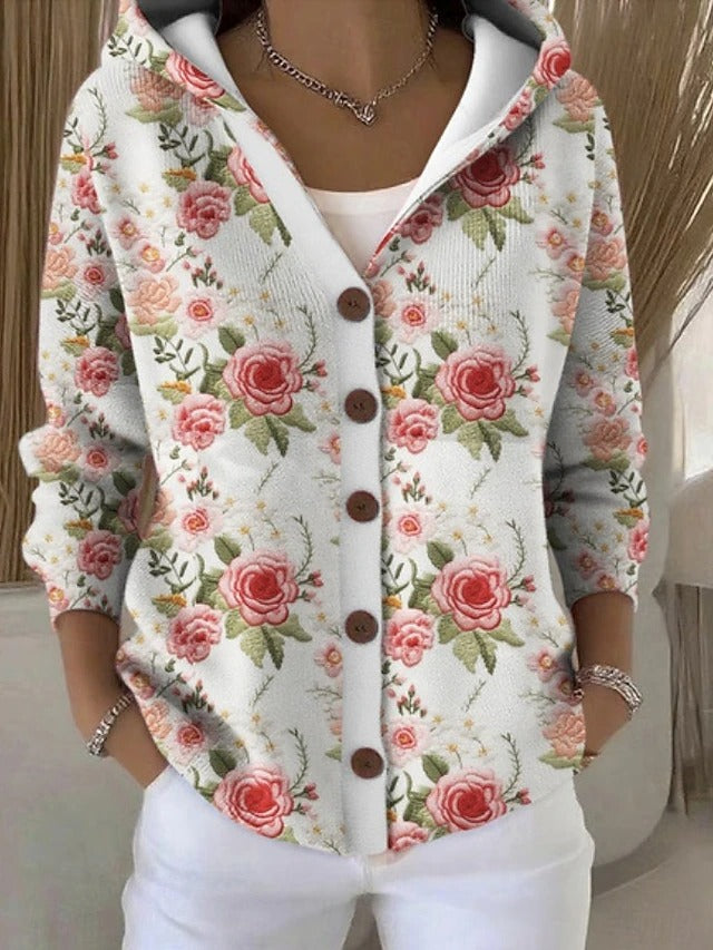Cárdigan blanco con capucha y estampado de Vega Madrid, largo y abrigador para mujer, con detalles de diseño visibles.