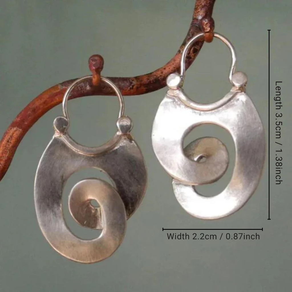 Pendientes de espiral vintage de color plata de Vega Madrid, con diseño en espiral y estilo clásico.