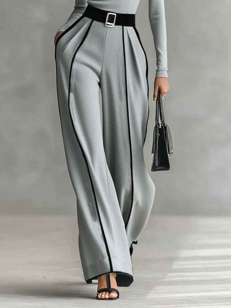 Conjunto elegante Inés de Vega Madrid con detalles en contraste en tonos gris, ropa de moda y estilo sofisticado.