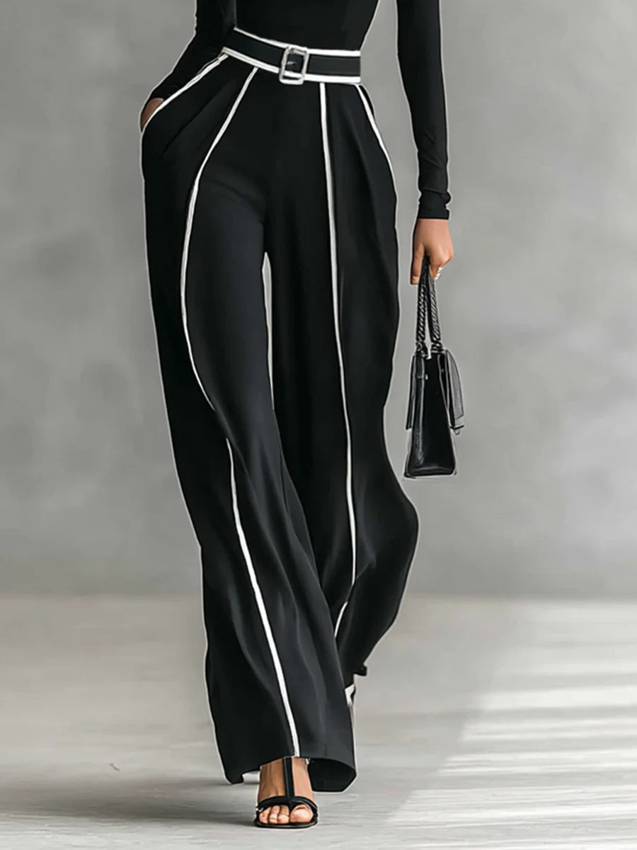 Conjunto elegante Inés de Vega Madrid con detalles en contraste, camisa y falda en tonos neutros y diseño sofisticado.