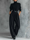 Conjunto negro Lisa de Vega Madrid con cinturón, ropa elegante y moderna, mostrado en la imagen con detalles del diseño.