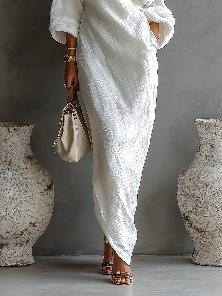 Vestido Chiara Perla de Vega Madrid, diseño elegante en tono perla, con detalles de estilo sofisticado y corte moderno.
