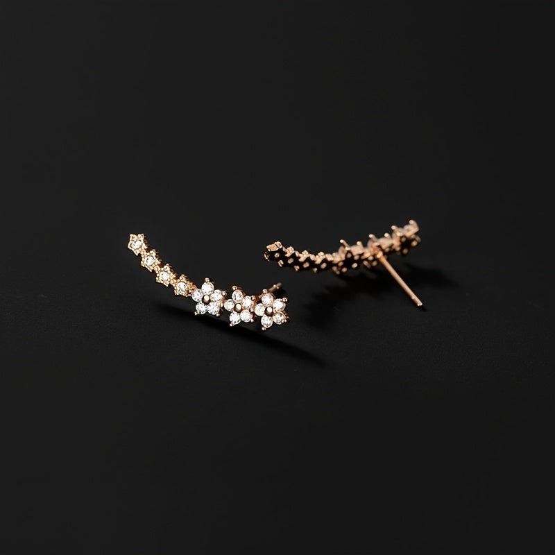 Pendientes florales elegantes de Vega Madrid, con detalles delicados y diseño sofisticado en acabado metálico brillante.