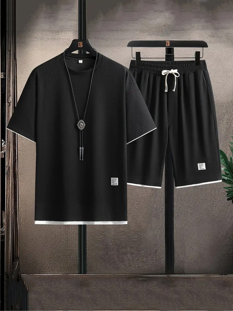 Black Bruno casual summer set from Vega Madrid featuring a stylish top and matching shorts.