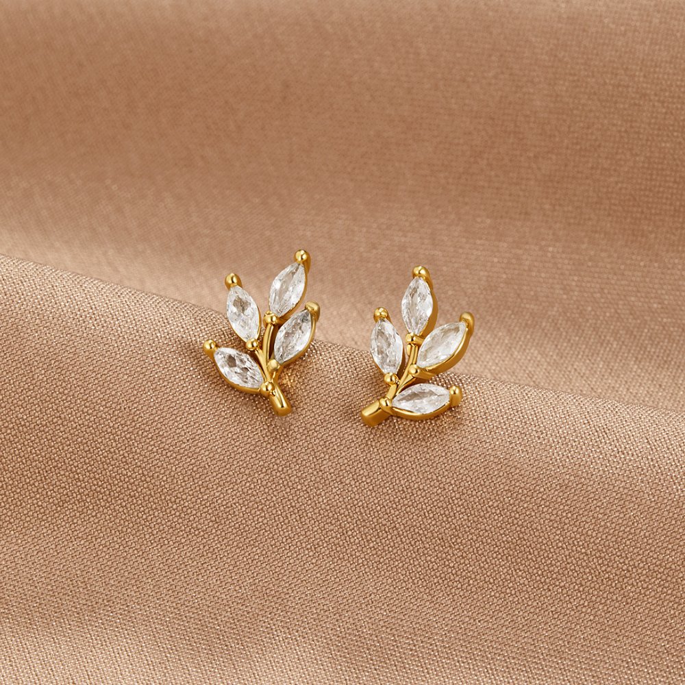Pendientes de aro en forma de hoja con cristales brillantes, accesorios de moda de Vega Madrid.