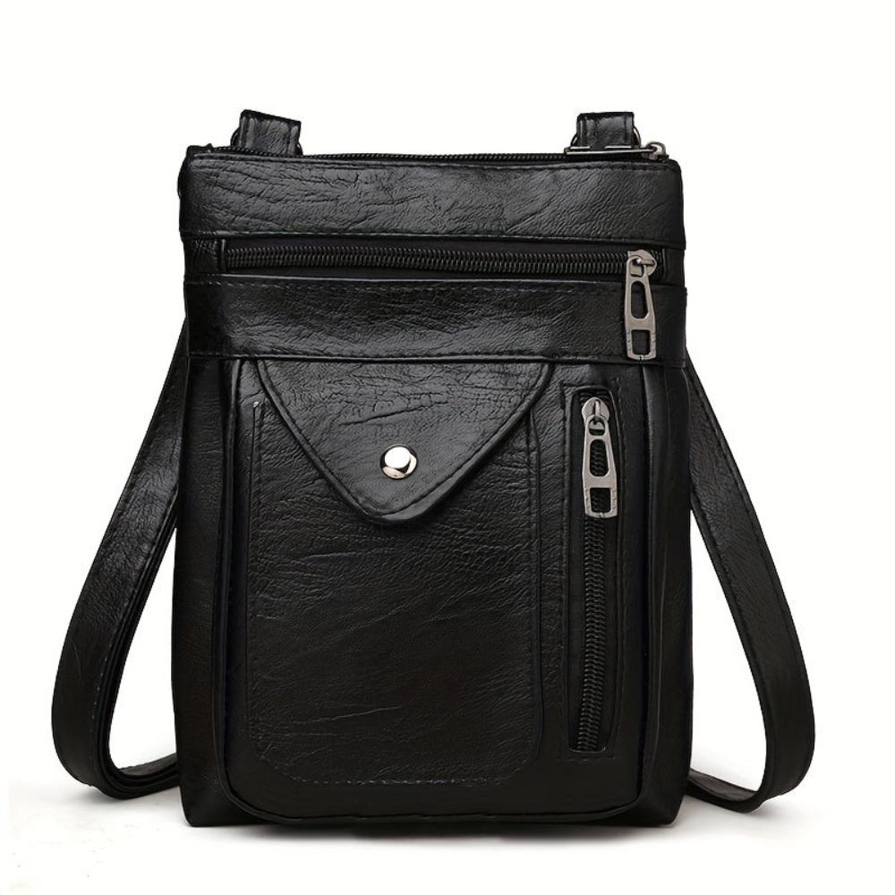 Bolso bandolera de piel Danielle de Vega Madrid, con asa ajustable y acabado elegante en color marrón.