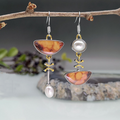 Pendientes retro naranjas Elodi de Vega Madrid con diseño llamativo y estilo vintage brillante en imagen.