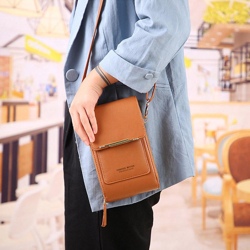 Bolso bandolera compacto Sandra de Vega Madrid, diseño minimalista en color negro y material de alta calidad.