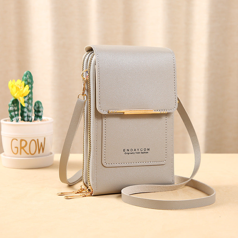 Bolso bandolera compacto Vega Madrid Sandra de diseño minimalista, con correa ajustable y acabado elegante en material resistente.